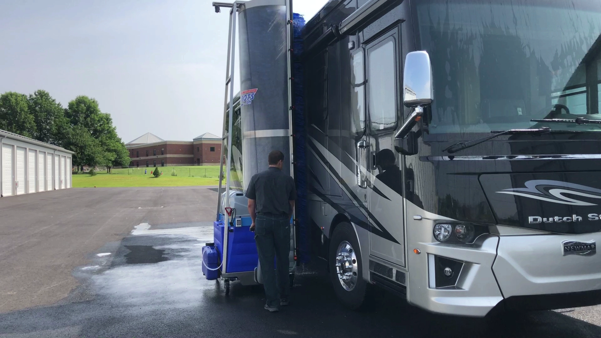 Automatic WashBot cleaning the side of a motorhome at Heritage RV Storage